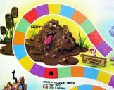 Colorful board game segment with "stick in mudslide town" and cartoon characters stuck in a mud pile.